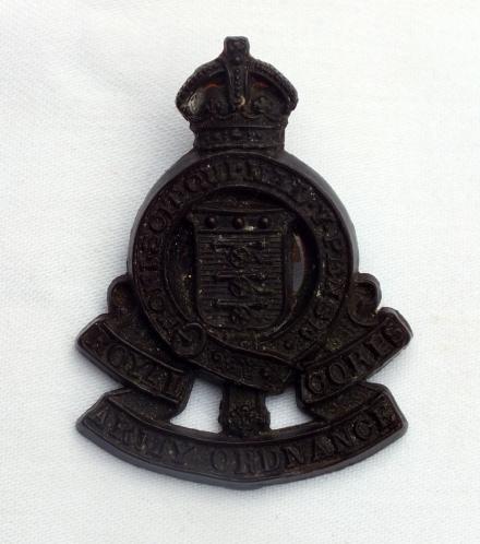 WW2 Economy Ordnance Corps plastic badge 
